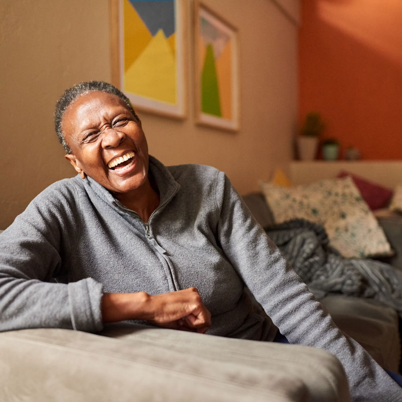 lady happy on couch