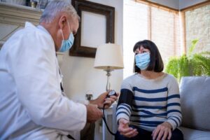 Doctor checking blood pressure for patient at Phoenix, AZ