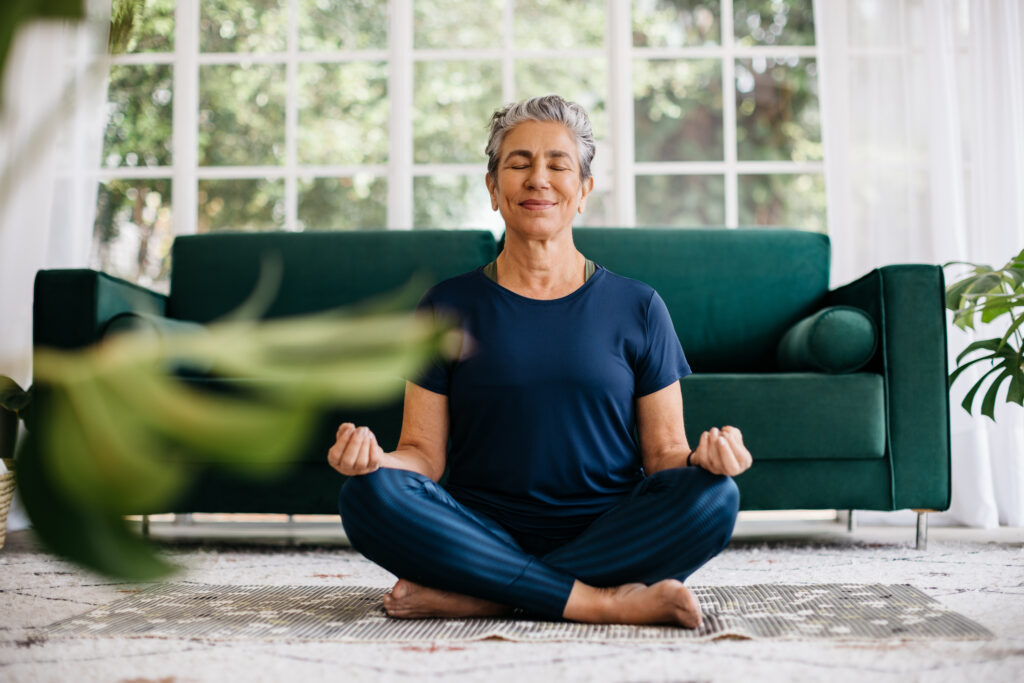 A woman doing yoga to cure varicose veins at her home in Phoenix, AZ