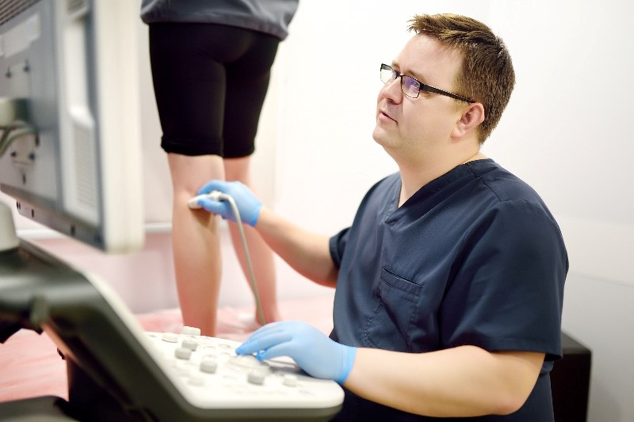 A woman getting an ultrasound on her leg prior to a phlebectomy by Arizona Vein & Laser Institute